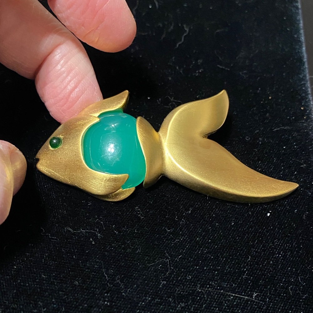 Givenchy vintage Matt gold tone with faux jade belly and eye brooch